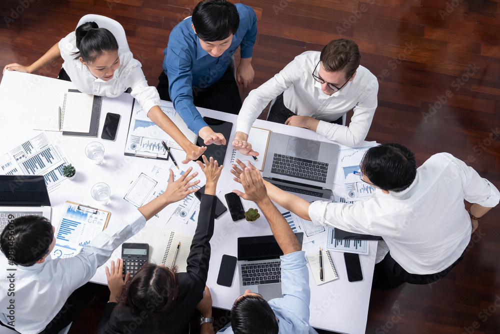 Aufkleber top view diverse office worker join hand together in office room symbolize business synergy and stro