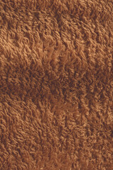 Texture of a brown faux fur as a background.