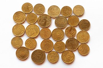 a handful of golden euro coins that look like gold