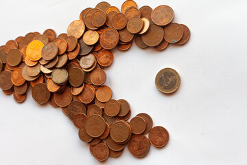 a large fish made of coins eating a smaller one to suggest the idea of a hostile takeover
