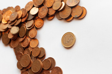 a large fish made of coins eating a smaller one to suggest the idea of a hostile takeover
