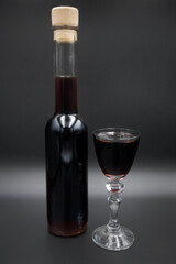 Cherry tincture in a glass, alcohol.
