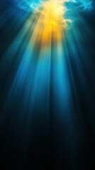 Obraz premium Light rays penetrate the calm blue ocean surface, creating a tranquil underwater atmosphere at midday