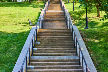 Concrete Staircase in Park with Benches and Lampposts Ascending Perspective