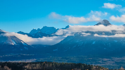 Panoramic view of snow-capped mountain summit Wertatscha in Rosental, Carinthia, Austria, Europe. Wild alpine landscape in Austrian Alps. Tranquil serene atmosphere at beginning of spring