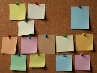 Office cork board with blank notes.