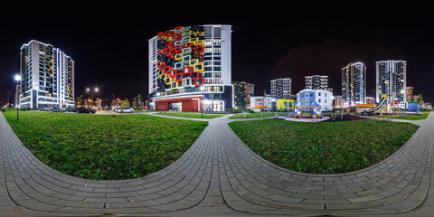 night panorama 360 near skyscraper multistory buildings with illumination of residential quarter...