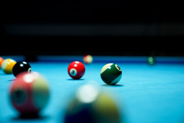 Billiard balls on blue table with billiard cue. Snooker, pool game