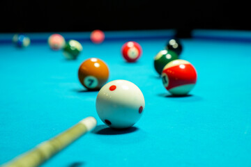 Billiard balls on blue table with billiard cue. Snooker, pool game