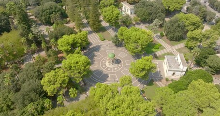 Aerial view of the gazebo in Giuseppe Garibaldi public gardens in Lecce, Puglia, Italy. It is a green area with trees and flowerbeds in the historic center of the apulian city. - Powered by Adobe