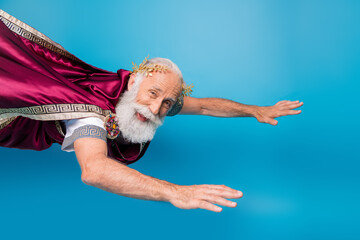 Photo of crazy funny person wear antique old culture costume mantle isolated on blue color...