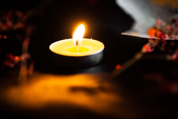 Defocused blurred background with burning candles.