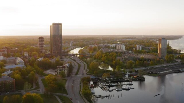 Aerial Riga, Latvia sunset cityscape of skyscrapers and traffic