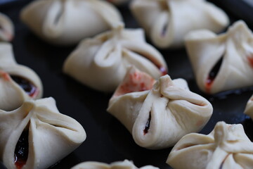 A pan filled with dumplings covered in sweet or savory jelly