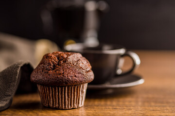 Sweet muffin cakes on wooden table.