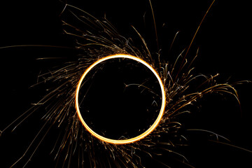 Circular lights with sparks on a black background