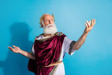 Photo of handsome senior male recite poem noble actor wear ancient greek god king dress isolated on...