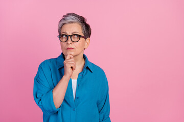 Photo portrait of pretty retired female look thoughtful empty space wear trendy blue outfit...