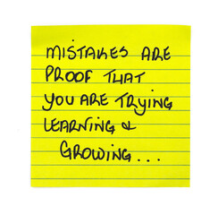 Handwritten motivational note “Mistakes are proof that you are trying, learning & Growing…”, Written on lined yellow sticky note paper.

