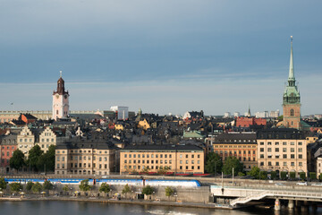 Stockholm skyline. Train crossing the bridge connecting islands