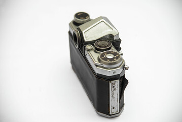 Poorly treated photo camera destroyed by time damaged broken