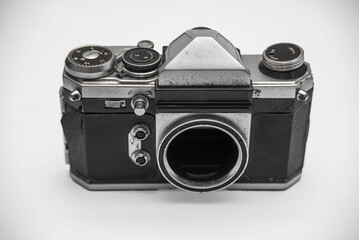 Poorly treated photo camera destroyed by time damaged broken