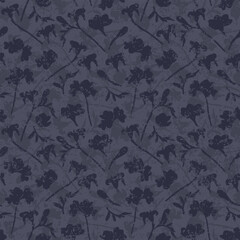 Monochrome vintage abstract floral seamless vector pattern with grunge effect. Loosely scattered fading floral silhouettes in dark purple for wallpaper, curtains, upholstery and fashion fabrics.