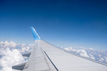 View from the airplane window of the wing and winglet soaring through