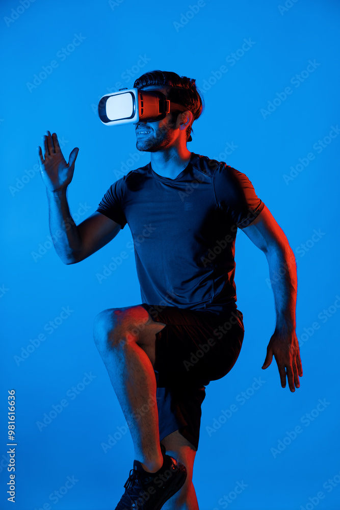 Poster caucasian smart man jogging while wearing vr goggle with neon light. happy person with casual cloth 
