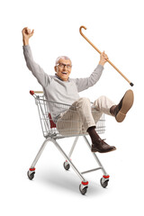 Happy elderly man sitting inside a shopping cart