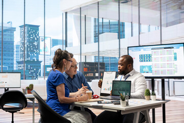 Senior couple in a detailed consultation with a financial advisor about retirement planning, covering investment strategy for savings growth and financial security. Insurance broker.