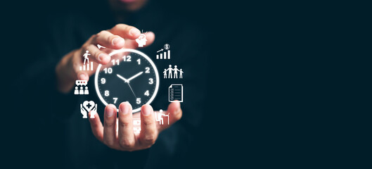 Time management concept. Man with clock and time managing icons in his hands planning his life, business, work for productivity using technology