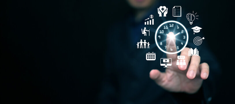 Time management concept. Man taps on clock with time managing icons planning his life, business, work for productivity using technology