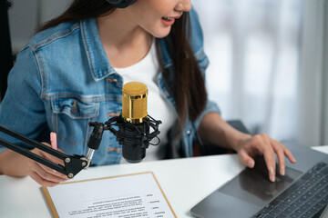 Host channel Asian influencer talking in broadcast streaming online wearing headset on social media...