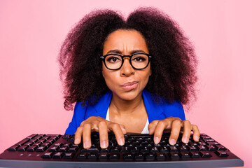 Photo of attractive minded confused girl trendy blue clothes typing writing texting isolated on...