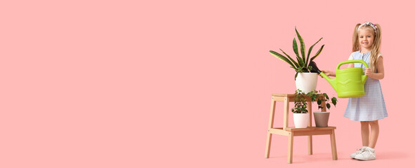 Cute little girl watering houseplants on pink background