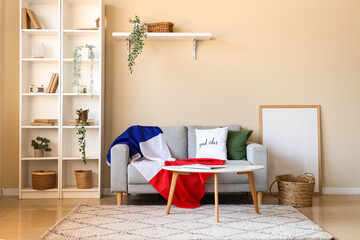 Interior of living room with French flag on sofa and table