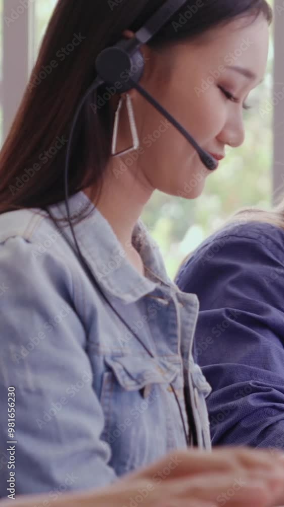 Poster customer support agent or call center with headset works on desktop computer while supporting the cu