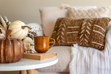 Fall decor on a coffee table in a cozy home