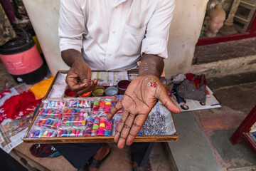 Temporary tattoo stamps at an outdoor market.