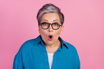 Photo portrait of pretty retired female shocked scared face wear trendy blue outfit isolated on pink color background