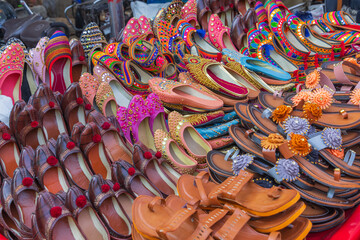 Traditional shoes for sale at an outdoor market.
