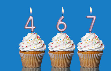 Birthday Cupcakes With Candles Lit Forming The Number 467