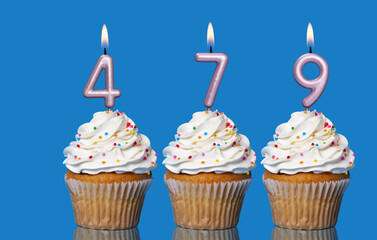 Birthday Cupcakes With Candles Lit Forming The Number 479