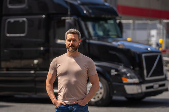 Truck driver. CDL. Men driver near lorry truck. Man owner truck driver. Millennial trucker. Trucking owner. Transportation industry vehicles. Handsome man posing in front of truck.