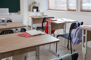 Interior of empty classroom with school desks