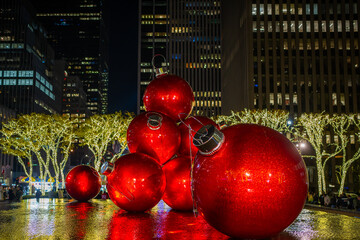 Christmas in New York. NYC, Year. NY celebrate Christmas. Manhattan in winter with big red Christmas balls. New York City. Manhattan in winter holidays. Christmas Ornaments in Manhattan.
