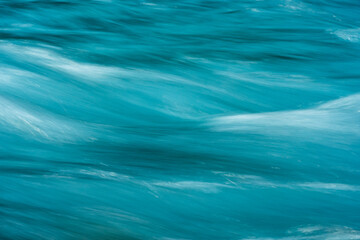 Waves of Blue Water Rush Across Image