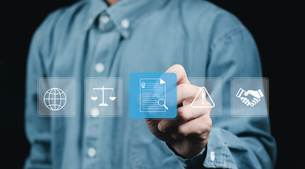 Compliance in business concept. Person use laptop with compliance icon on virtual screen, ensuring the enforcement of laws, regulations, and standards. Stay in line with business policies..