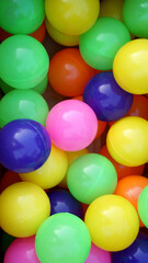 Colorful plastic balls. Green yellow blue orange pink